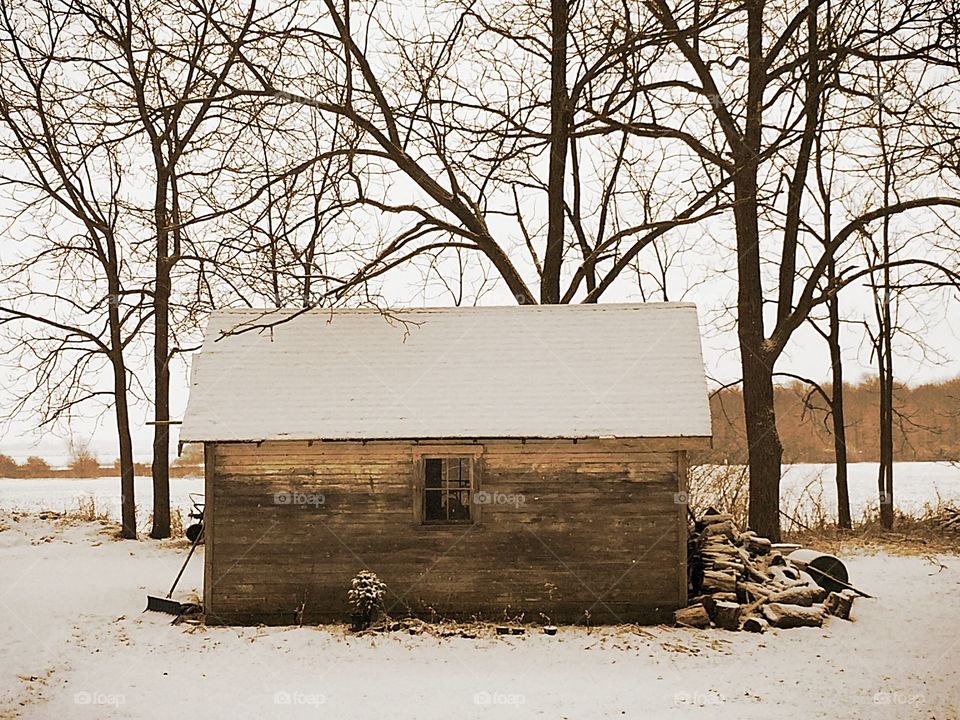 Wood shed. Snow fallen day