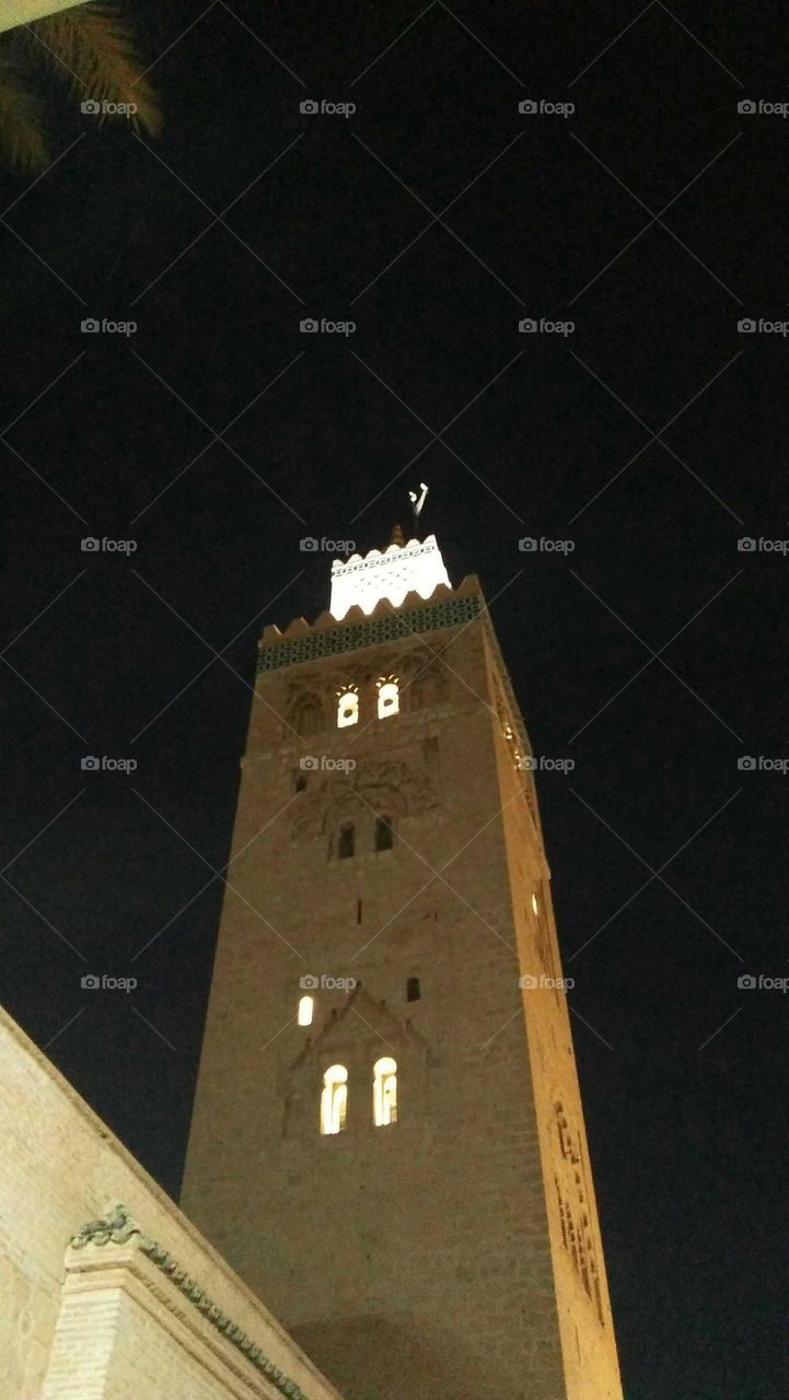 Beautiful minaret at night  of a famous mosque at marrakech city:  the KOTOUBIA mosque in Morocco