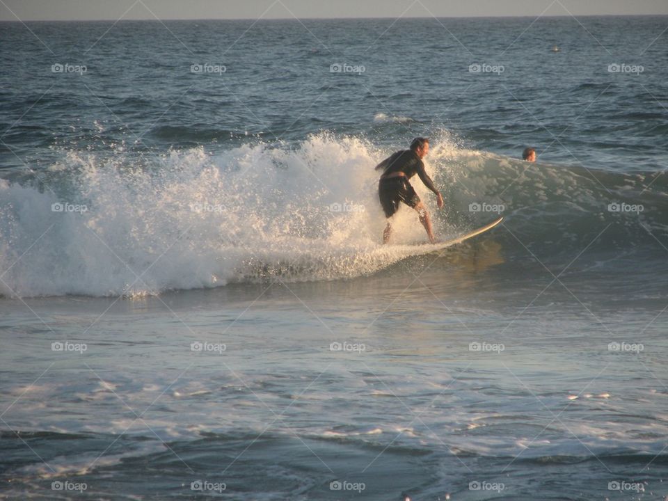 Surfer Riding a Wave