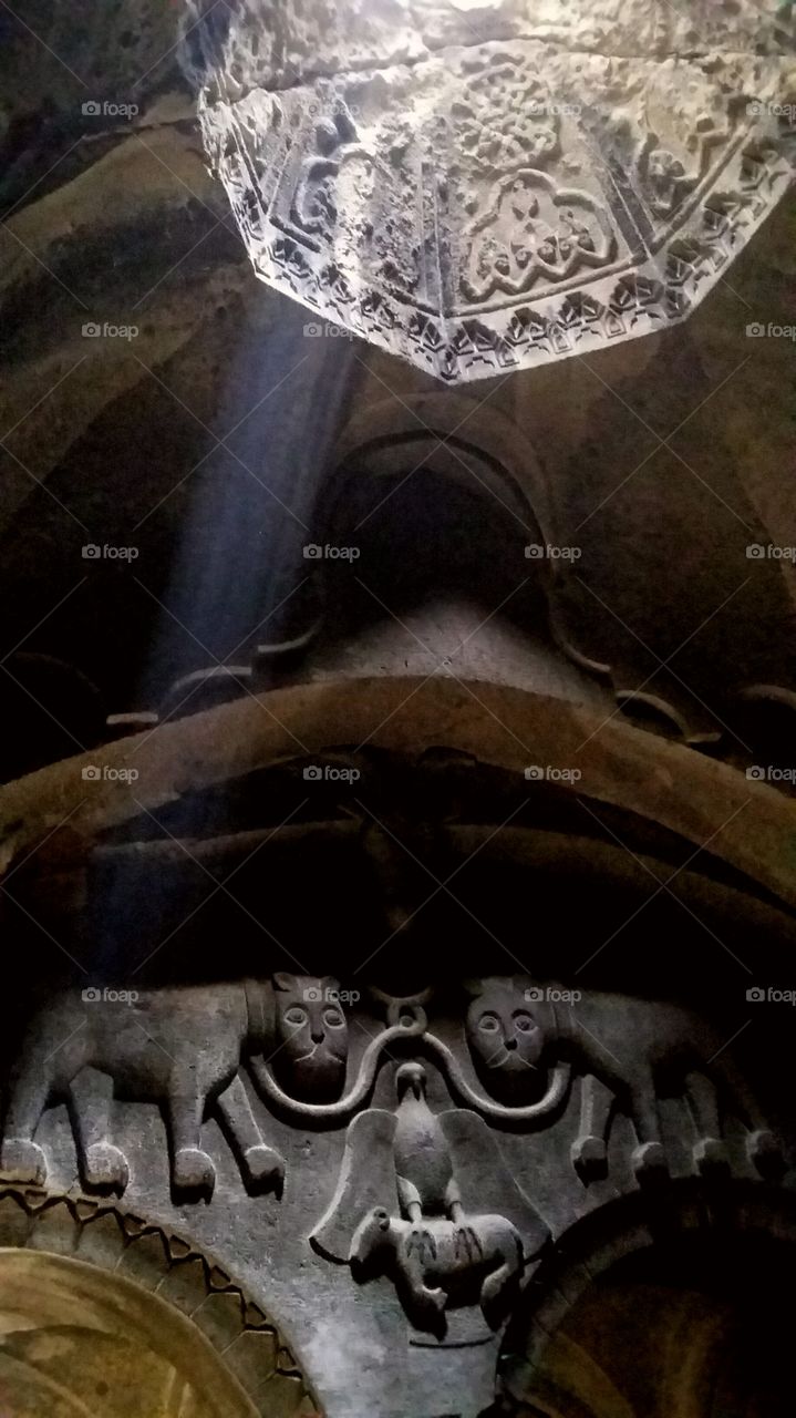 When a sunray finds its way to enlighten a hand-carved cave in Geghard Monastery, Armenia.