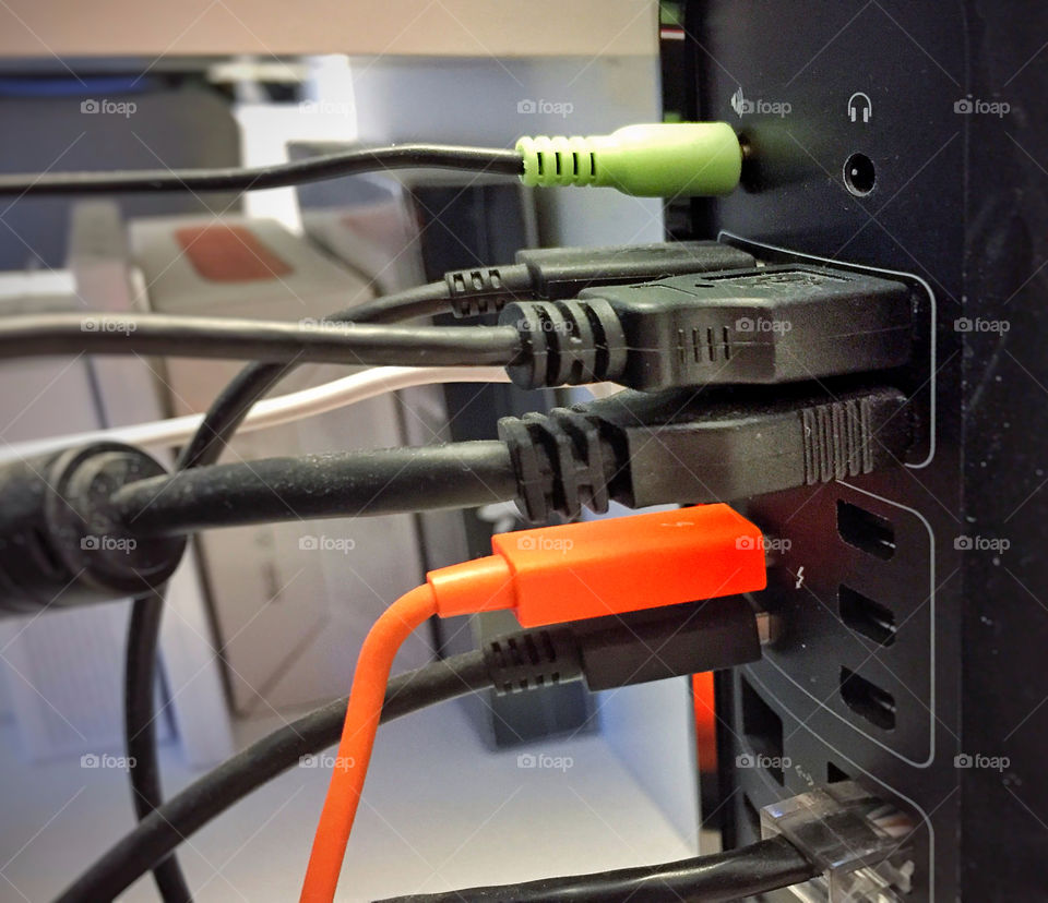 A group of USB cables plugged into a computer 