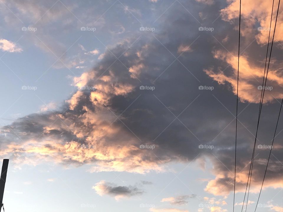 Colorful photo of a big cloud in the sky.