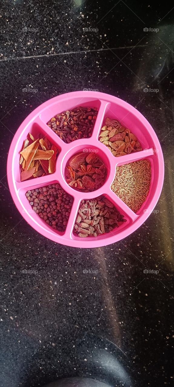 Indian spices in a plastic container