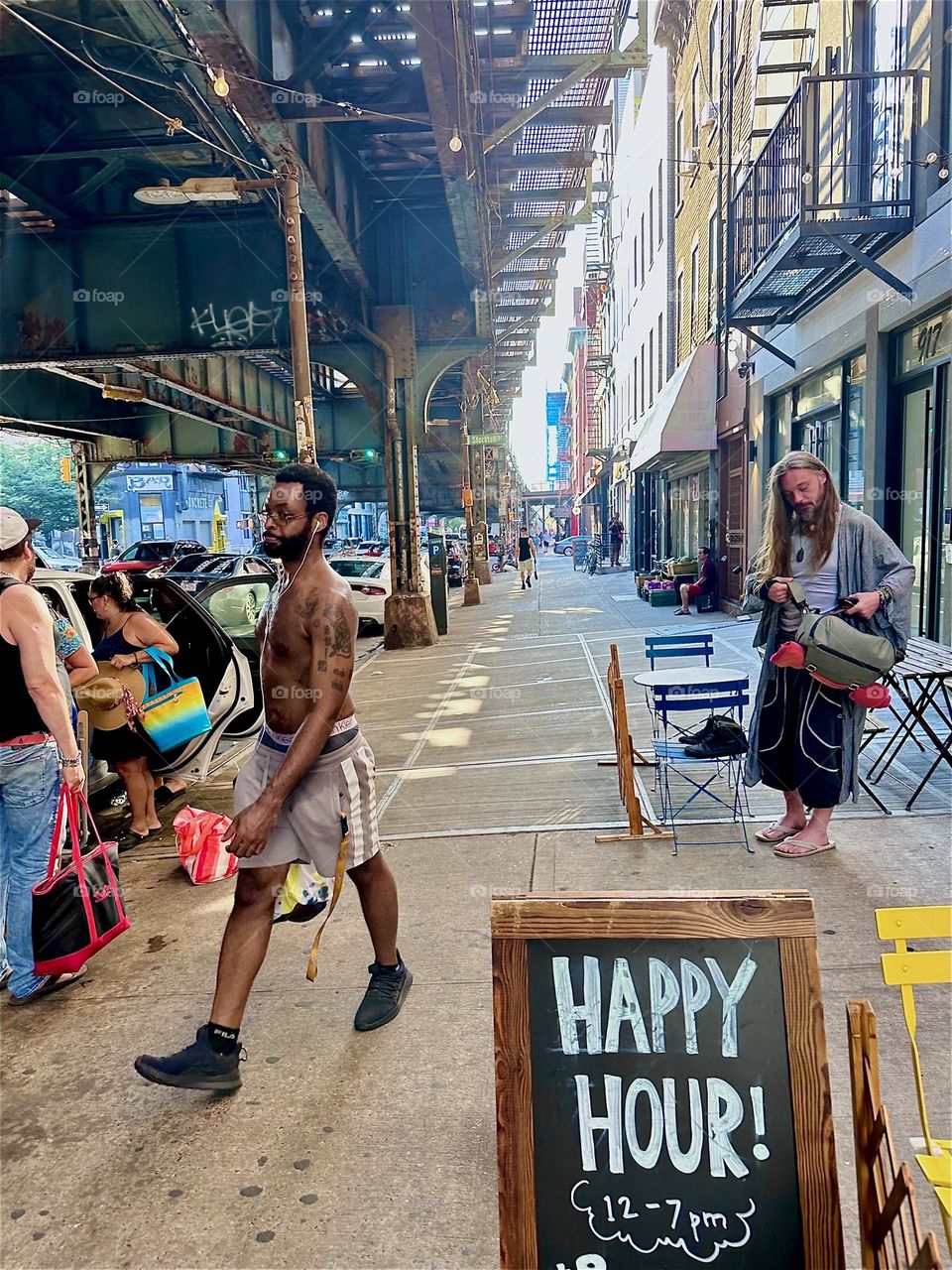 It’s “HAPPY HOUR” here in the epicenter of “Bushwick”, Brooklyn on “Broadway” and “Myrtle Ave” by the “M” train “Myrtle Ave” station and overpass in NYC. Drinks are half price and people are welcome at the bar next door. 2024. Hypnotic Productions