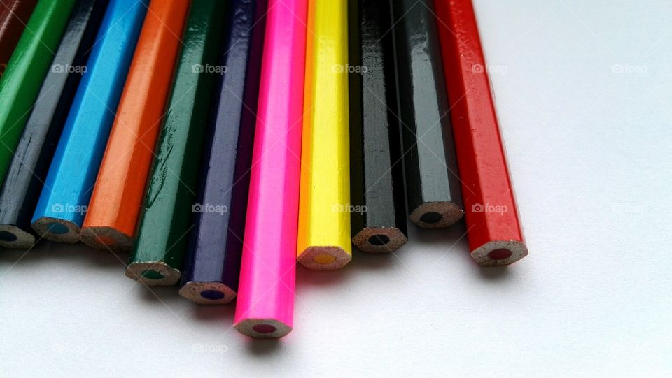 colorful pencils on white background