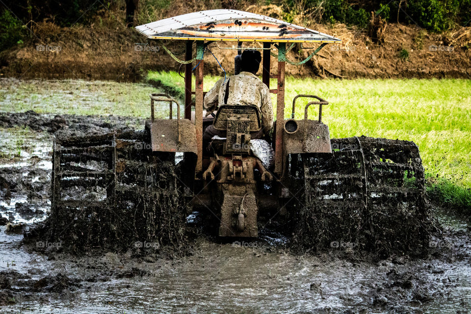 A story of poor farmer who was cultivating his land with Tractor