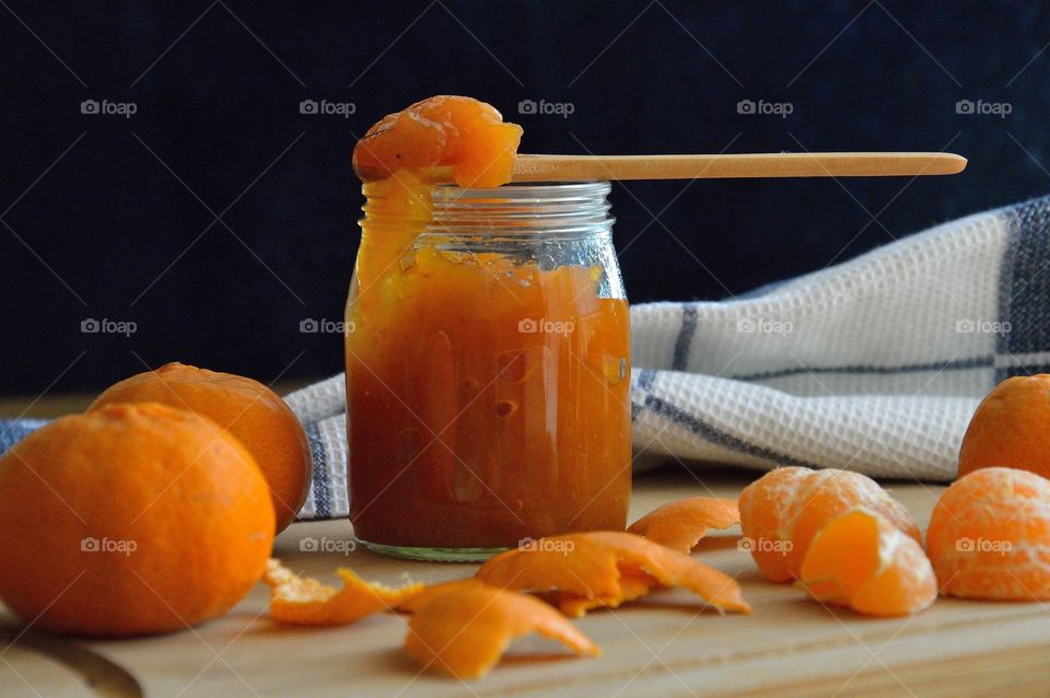 tangerine, jam and spoon