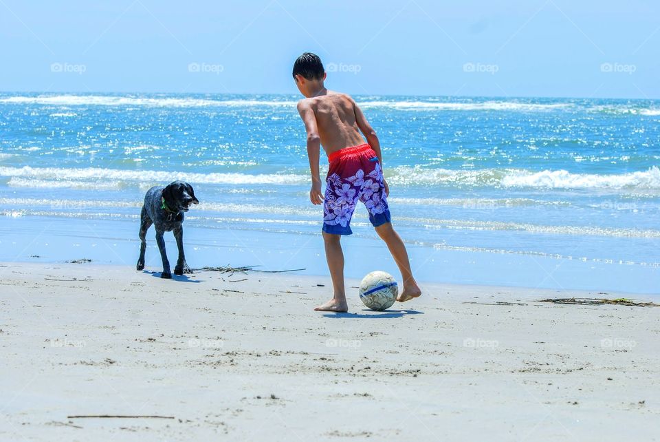 making memories playing kickball with dog