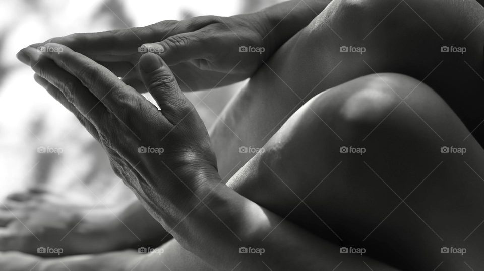 Closeup praying hands and bent knees