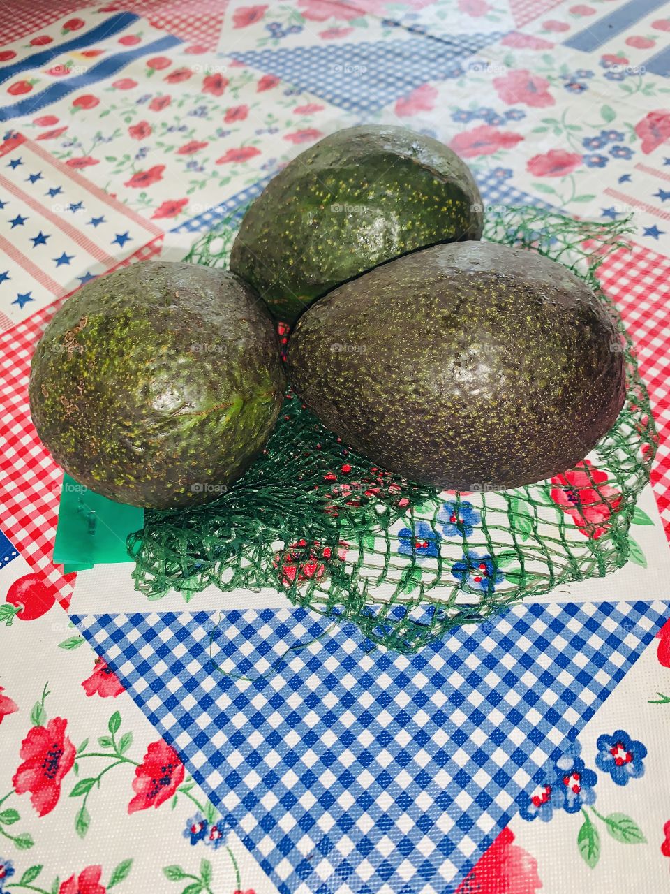 

A - Three Avocados -  waiting for the to get soft - Avocado fruits have greenish or yellowish flesh with a buttery consistency and a rich, nutty flavor. They are often eaten in salads, and in many parts of the world they are eaten as a dessert.