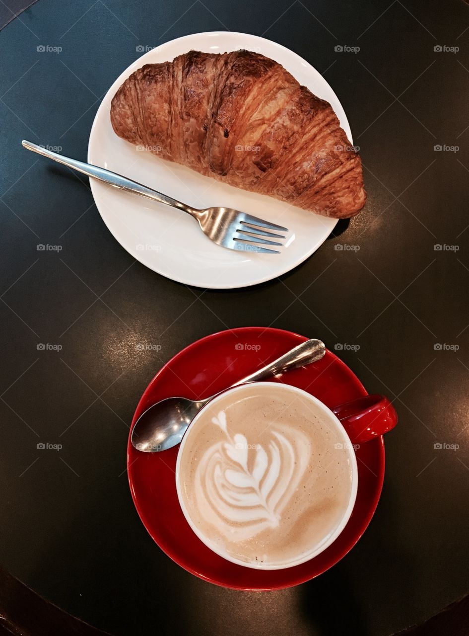 Enjoy hot coffee with croissant