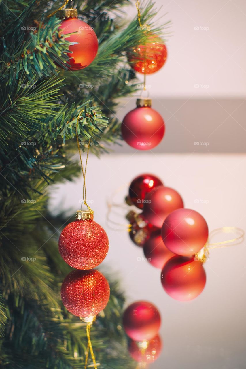 Closeup shot of magenta Christmas decorative balls on tree