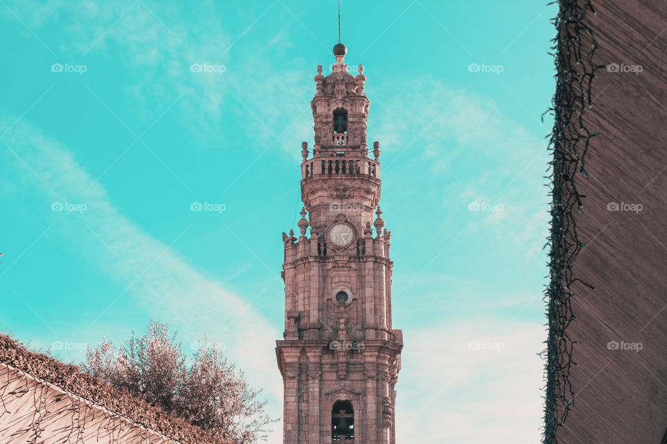 Clerics Tower under a blue sky, iconic landmark of Porto.