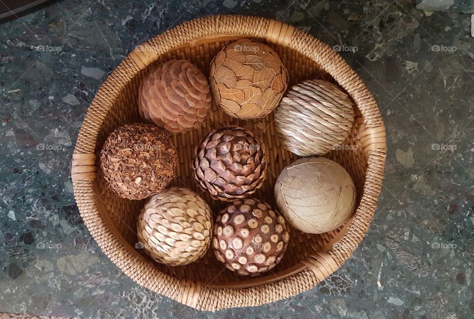 basket of spheres. various textured spheres in a basket