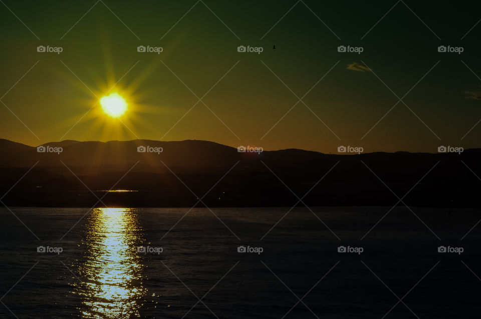 Silhouette of mountain during sunrise