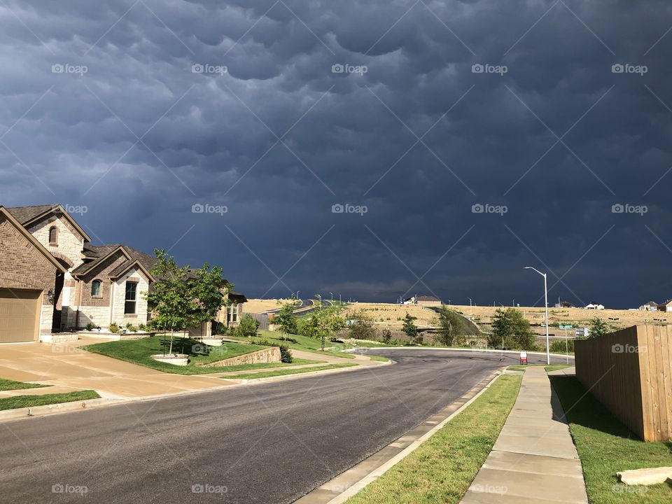 Cool composition with sun and cloudy sky in neighborhood