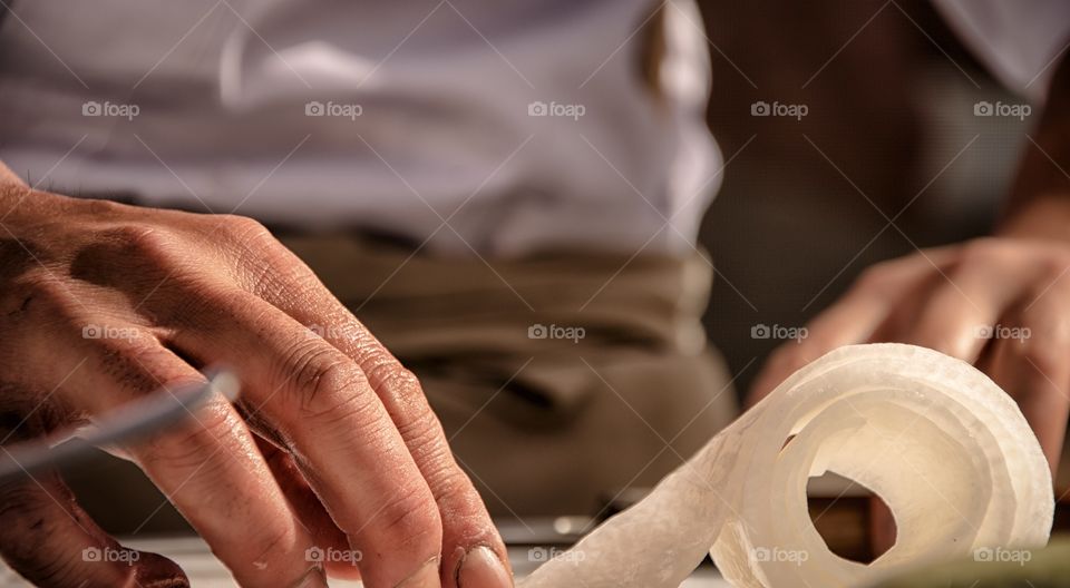 Midsection of person preparing sushi