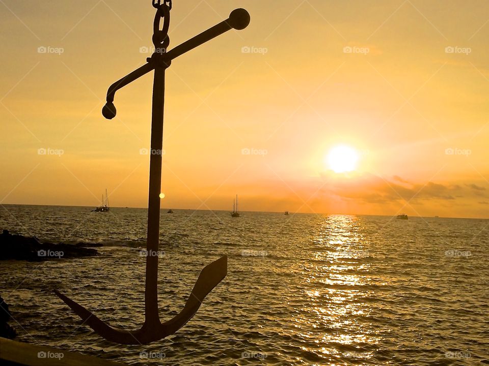 Anchor over sunset
