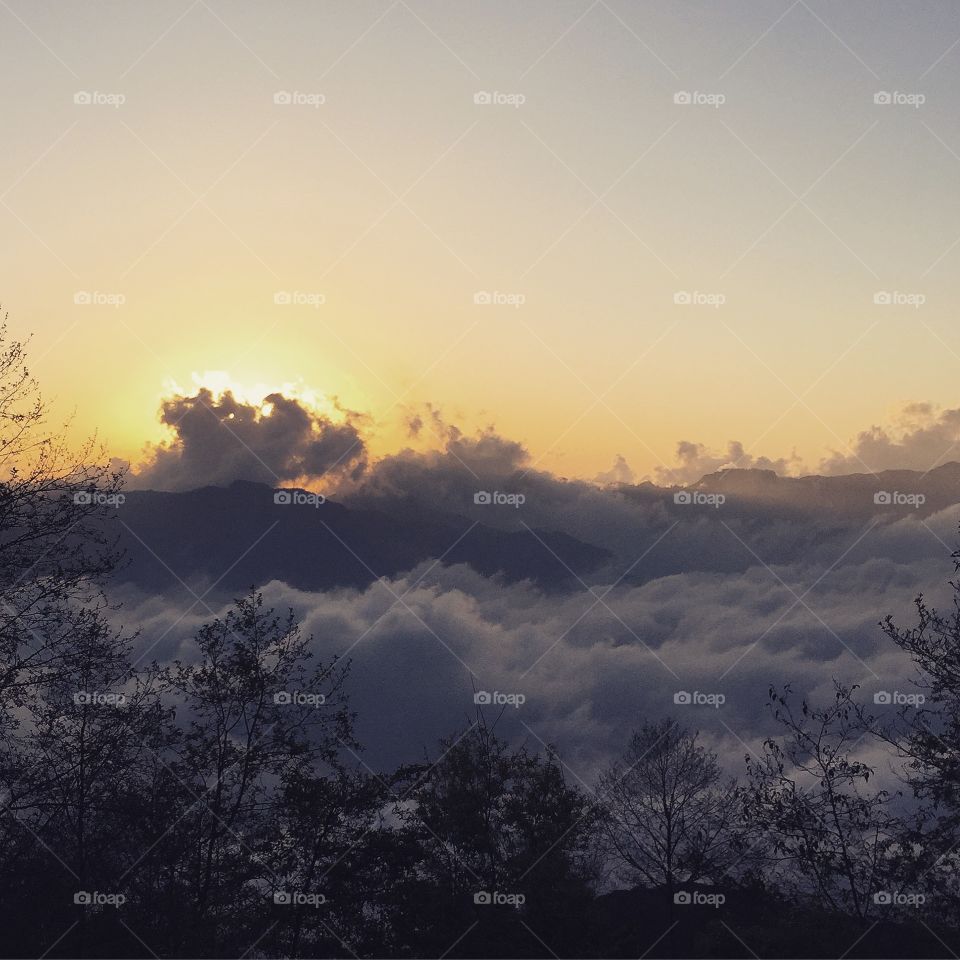 Clouds over the mountain during sunset
