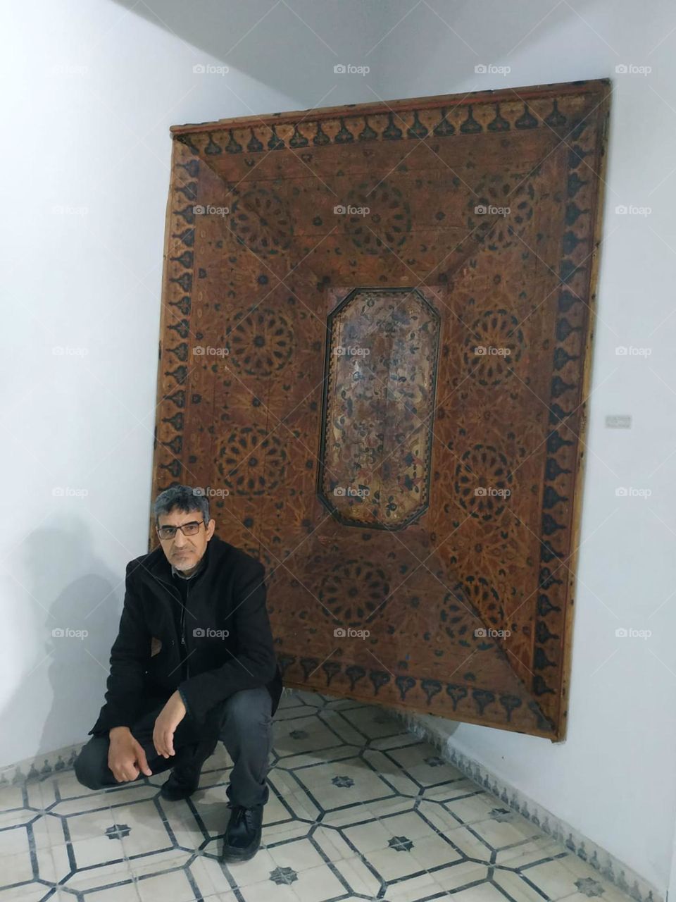 Im sitting near an ancient door.