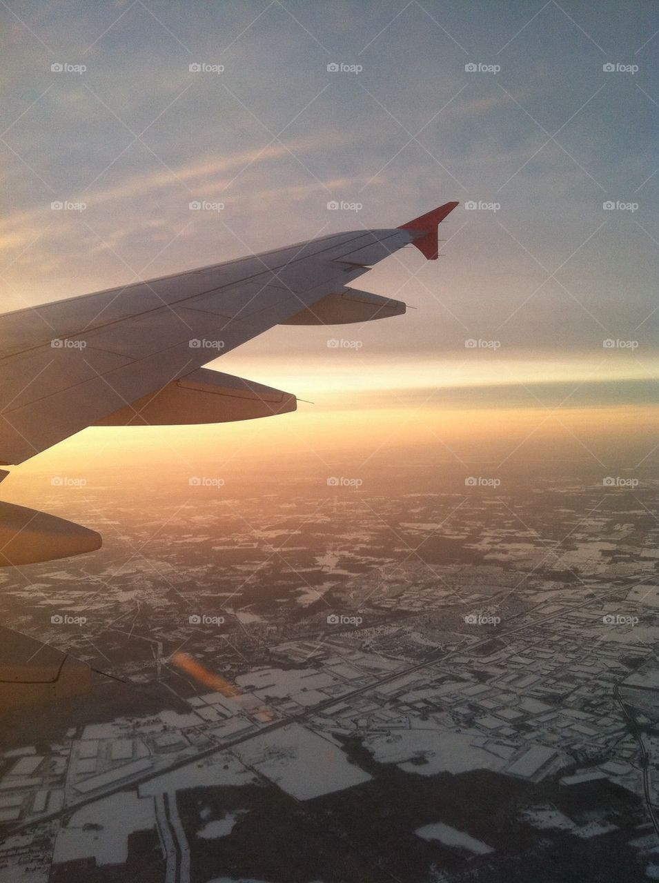 Airplane wing seen through window
