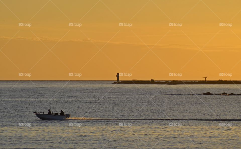 Silhouette of boat on sea