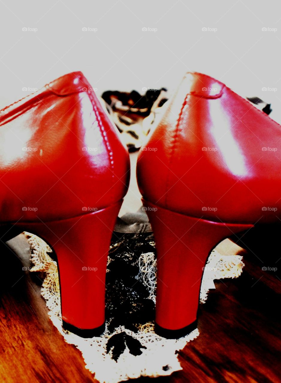 red women's high heel shoes fashion still life close up