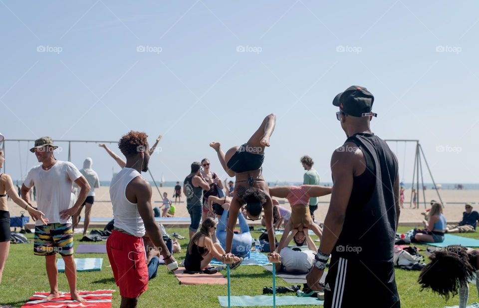 Athletic people showing off their skills in a public park 