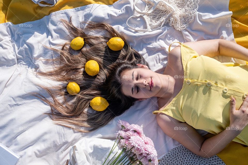 woman with lemons in hair