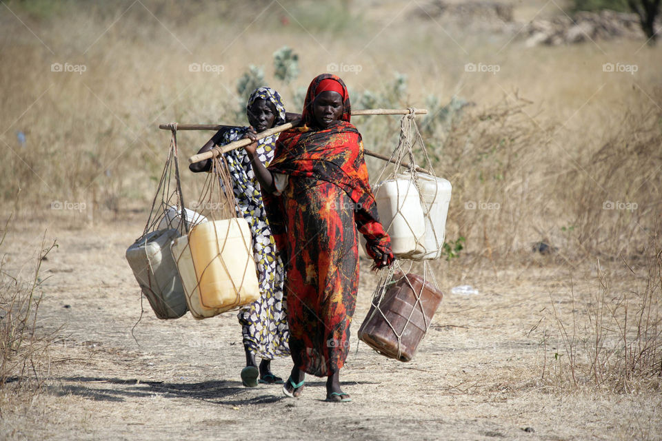 Women in Africa suffer from water scarcity and are responsible for preparing food for the home and children