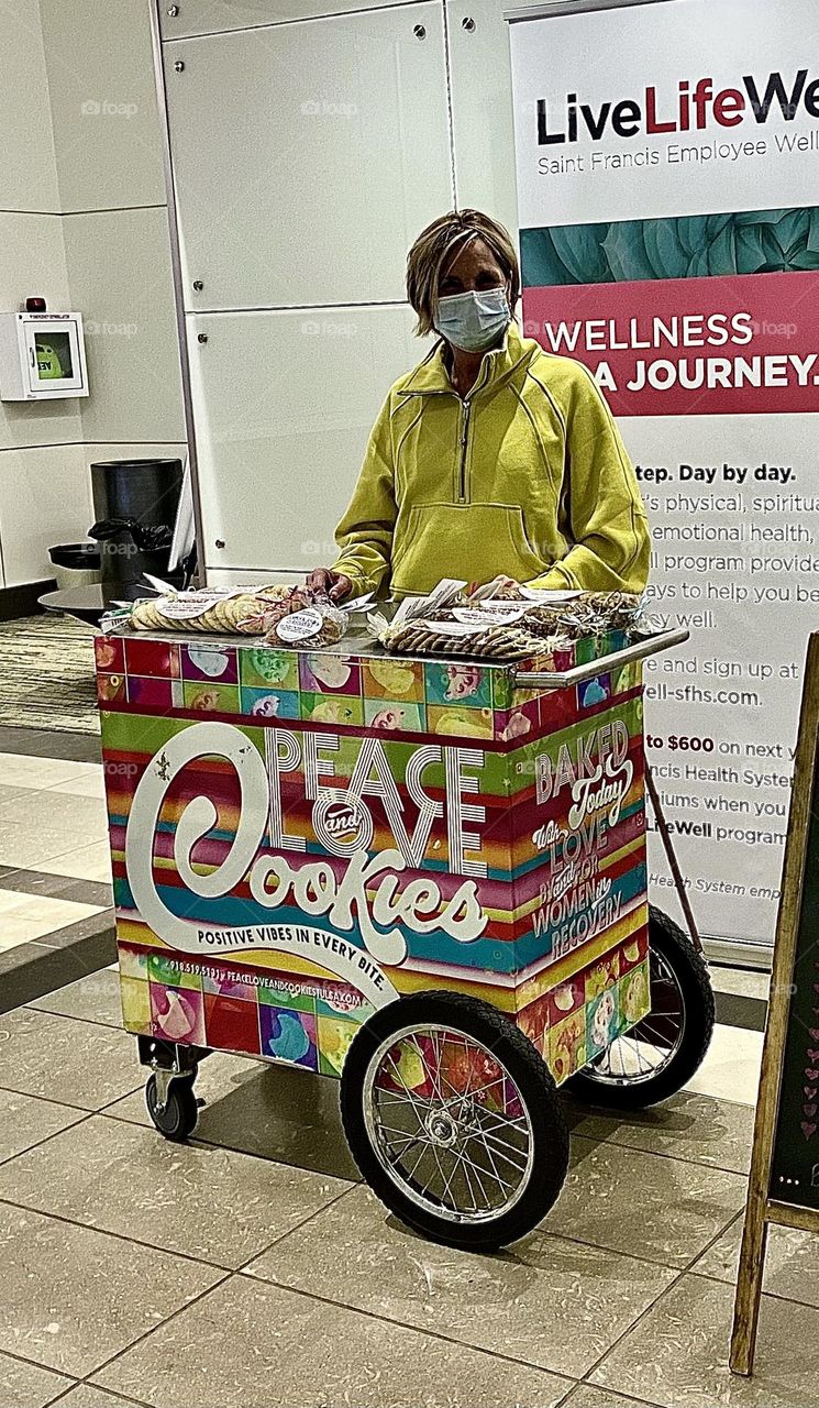 Peace love cookies she gets out and sell her cookies and people look forward to her coming to the hospital with her delicious delivery of cookies. She sends a positive message daily go check her out. Women History month