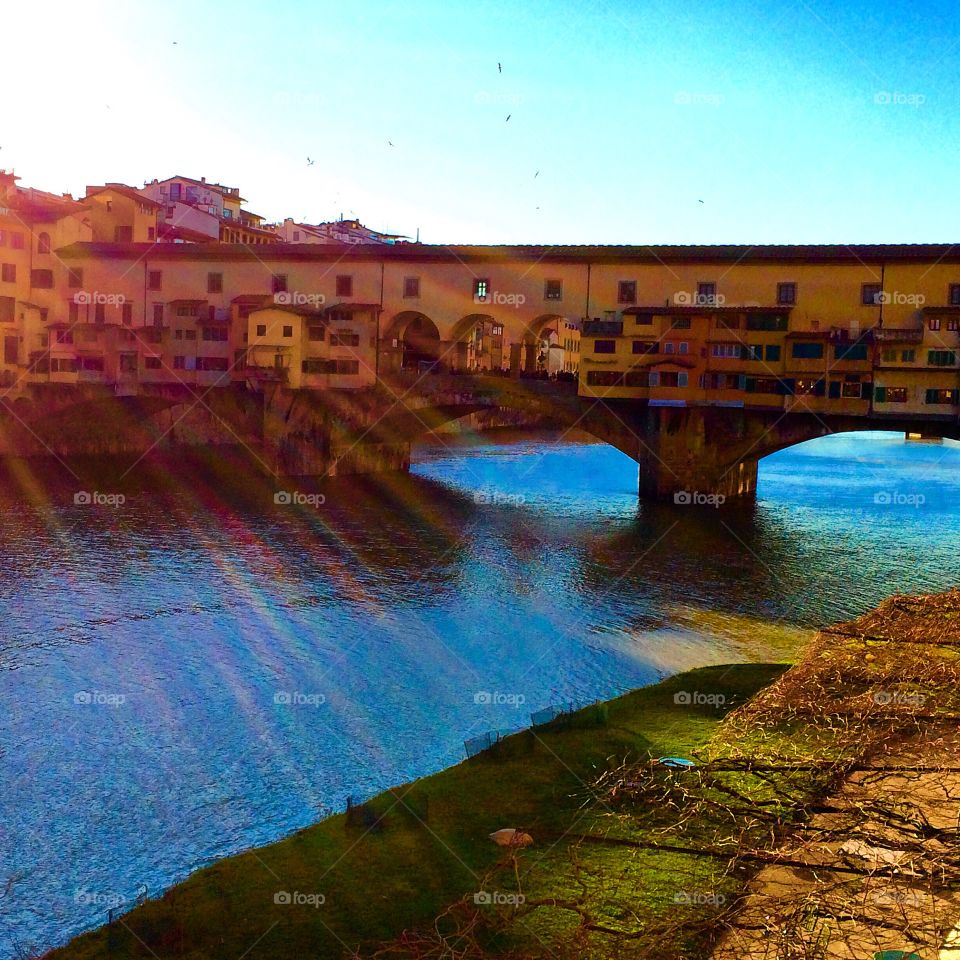 Colorful afternoon view of gorgeous Ponte Vecchio in Florence Italy 