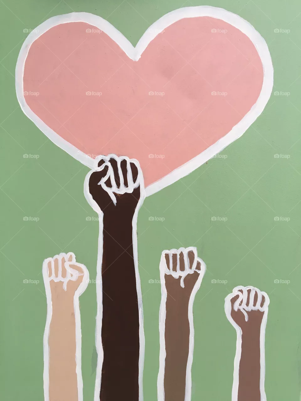 Unity artwork of hands holding pink heart 