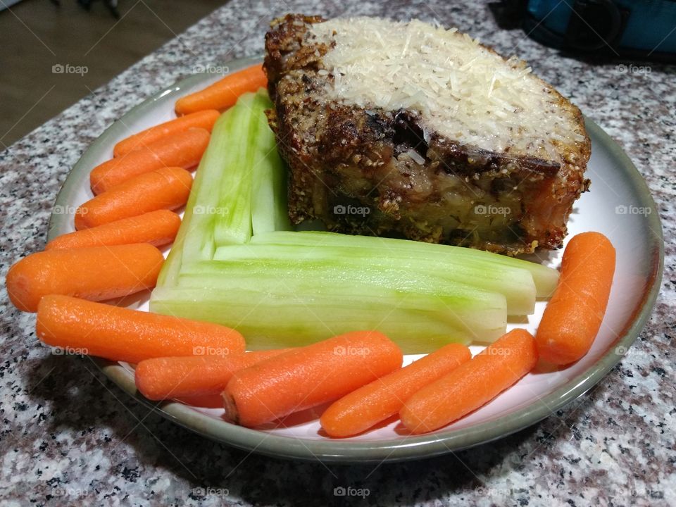 low-carb parmesan-crustes pork chop with vegetables.