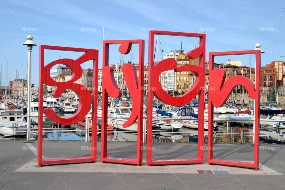 Monument Letronas, Gijon. Monument called Letronas in Gijon, Asturias, Spain that represents the tourist brand of the city located in the Marina