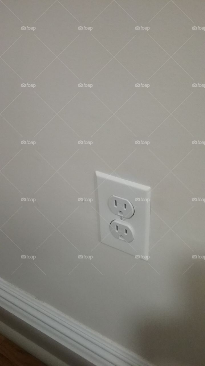 electric outlet on white wall