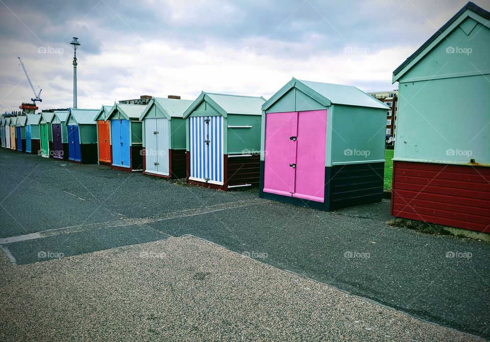 bright and colorful beach sheds in a coastal town