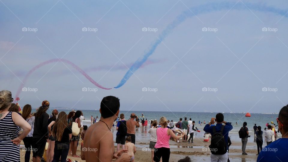 Air show on the beach with crowd