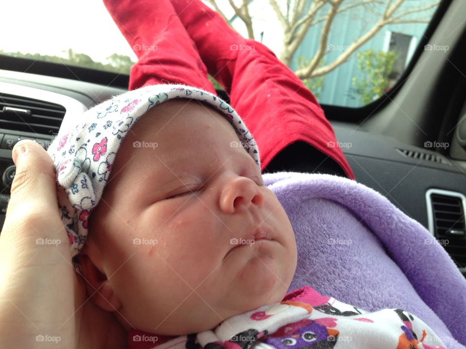 Newborn and red boots on Halloween 