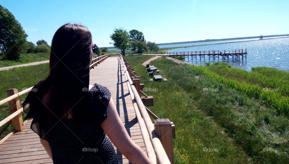 Women on a wooden bridge