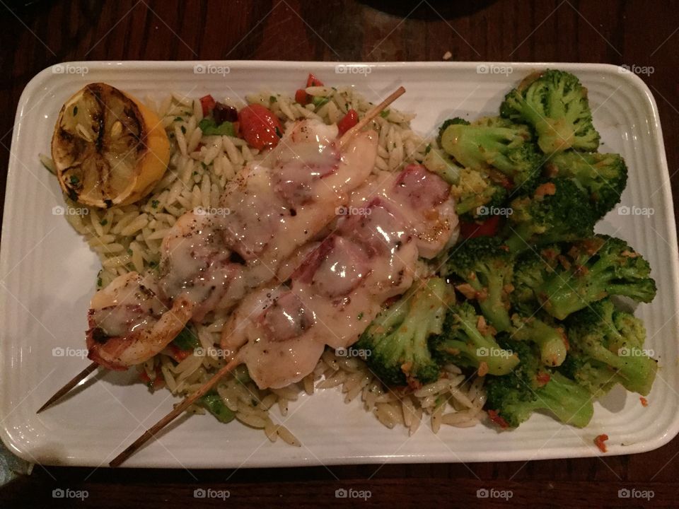 Delicious gulf shrimp in hazel butter sauce, over a bed of seasoned rice and steamed broccoli! Oh so tasty!