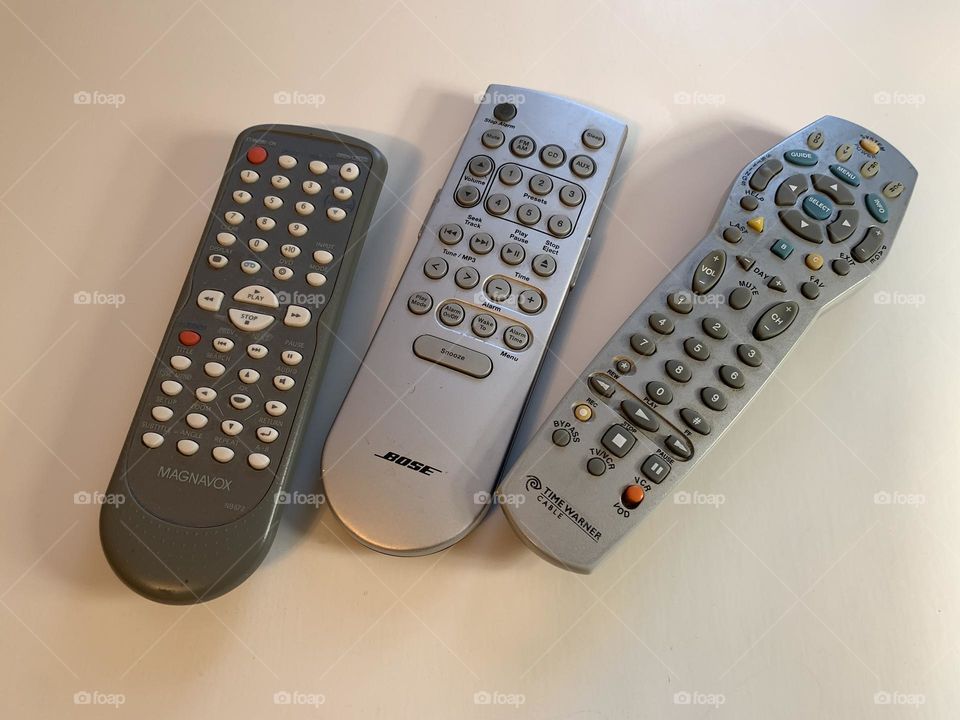Three remote control against white background.