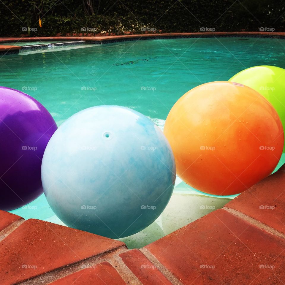 Have a ball. Pool, summer, fun, back yard, California, colors, balls, play