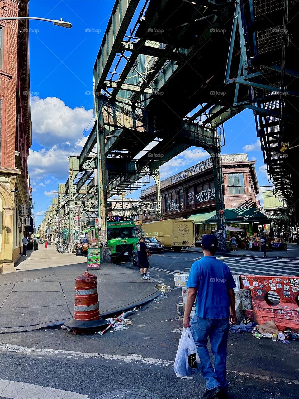 Two overpasses intersect here diagonally, one above “Myrtle Ave” and one above “Broadway” in “Bushwick”, Brooklyn. The industrial minimalist structures create interesting patterns with overlapping shadows at sunset time. 2024. Hypnotic Productions