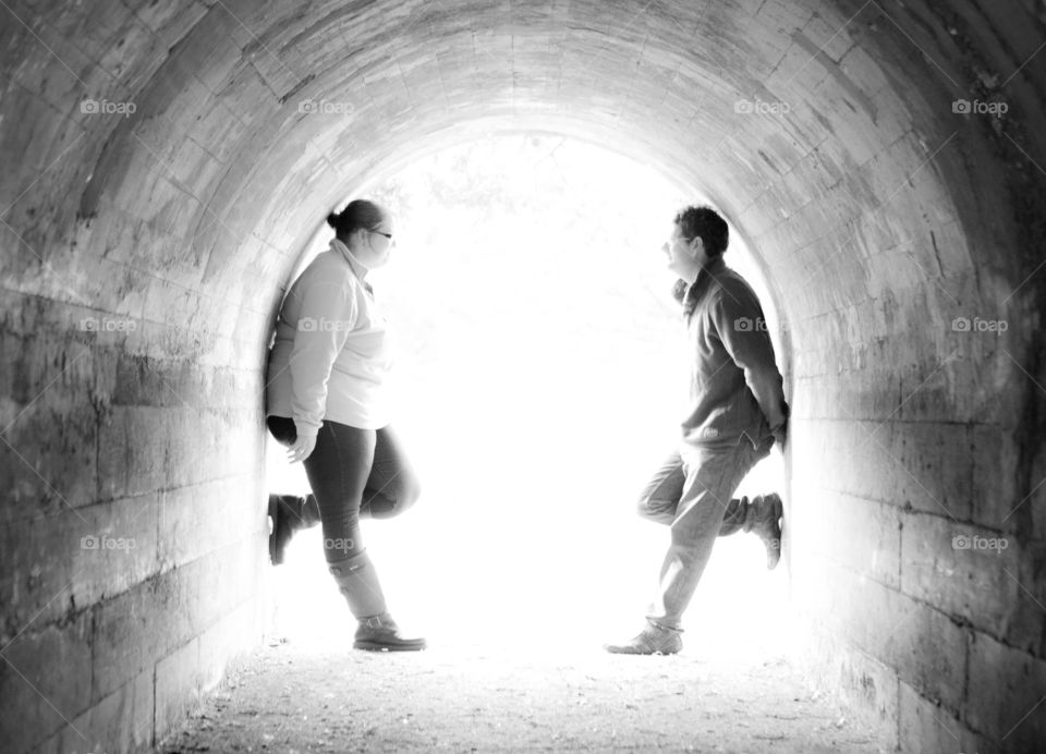 Two friends standing in tunnel