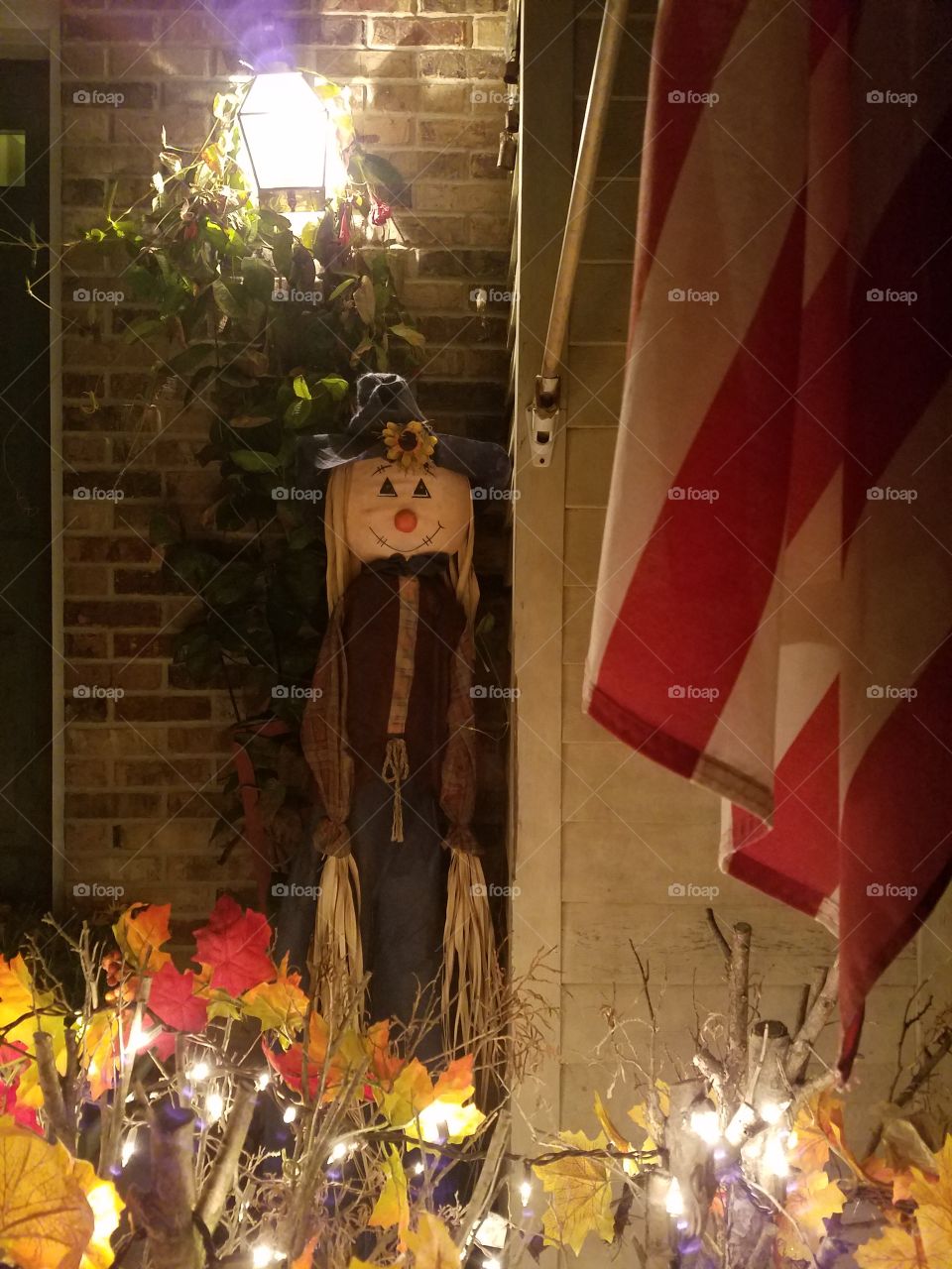 Scarecrow in front of house