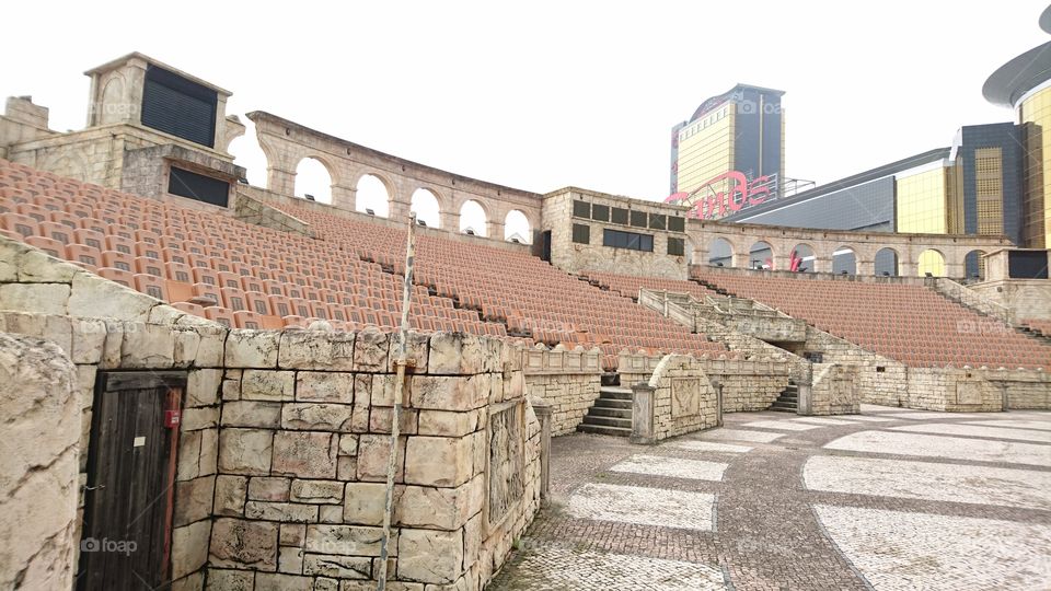 inside view of the ancient gladiator arena in Rome. Macau version.  behind is the one among the biggest casino in Macau. Sands macau