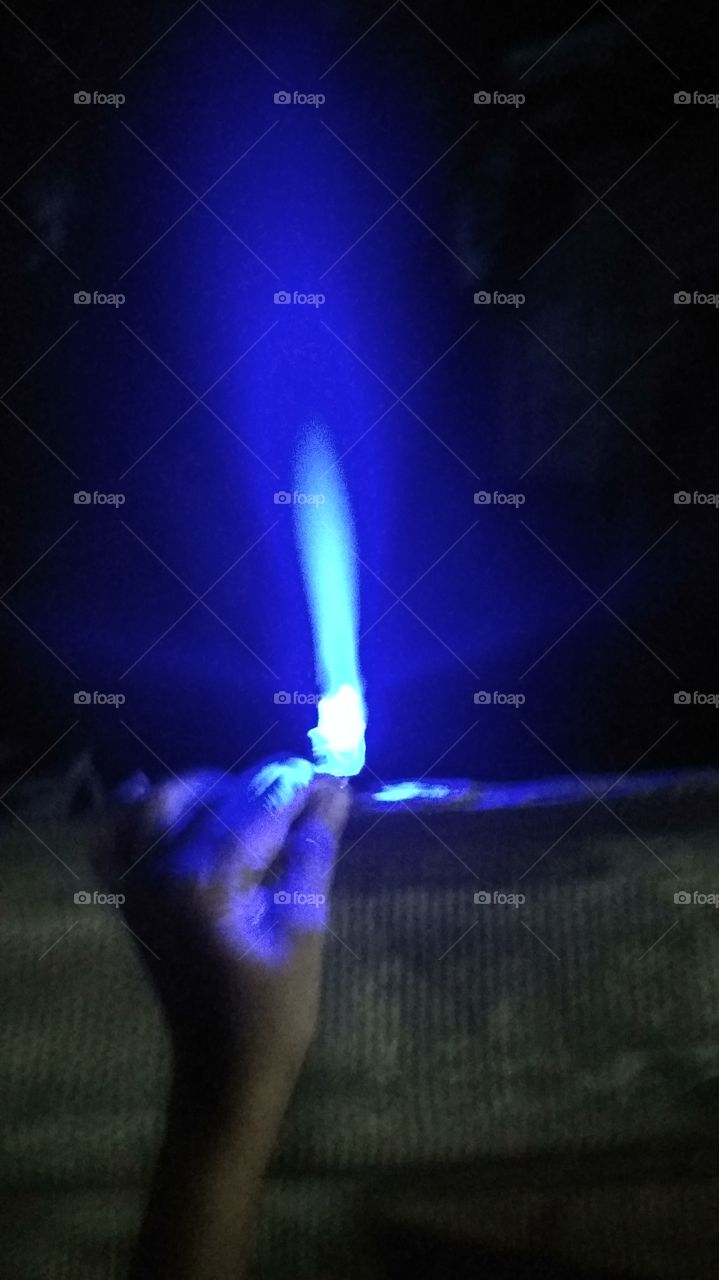 child playing with nighttime led light