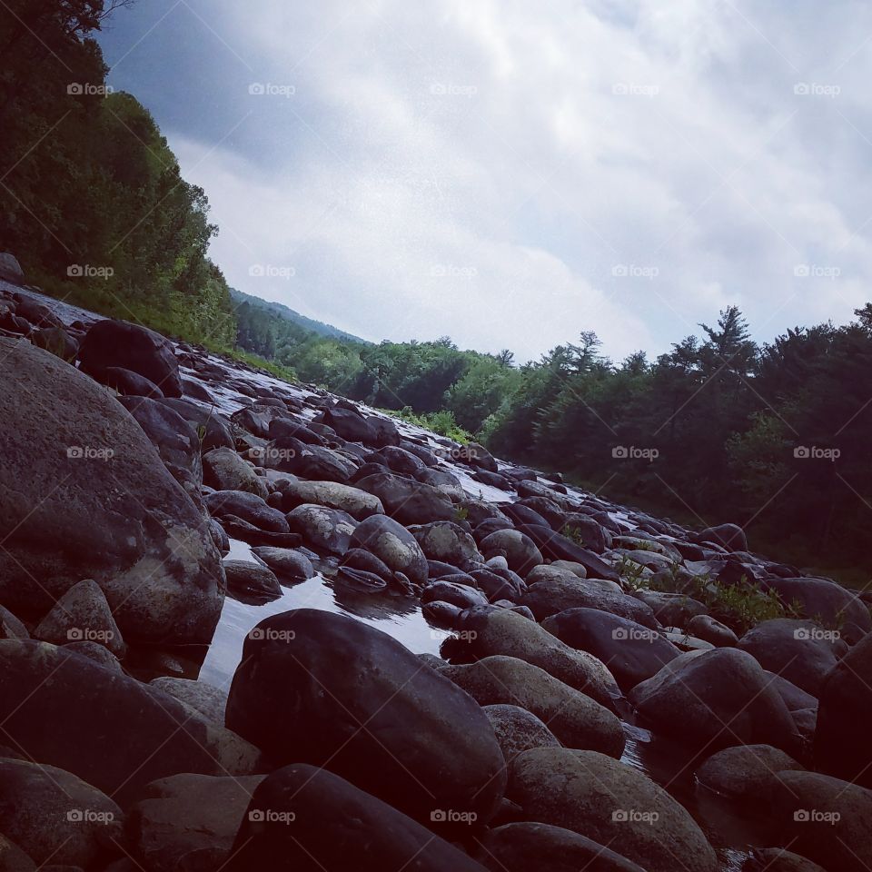 Long journey hikes worth the sights, a river a flow down it goes.