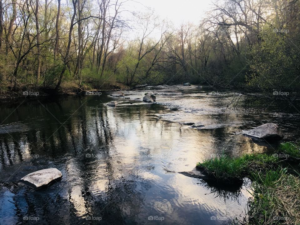 Reflection in river, during a beautiful fall day in Chippewa Falls, Wisconsin, USA